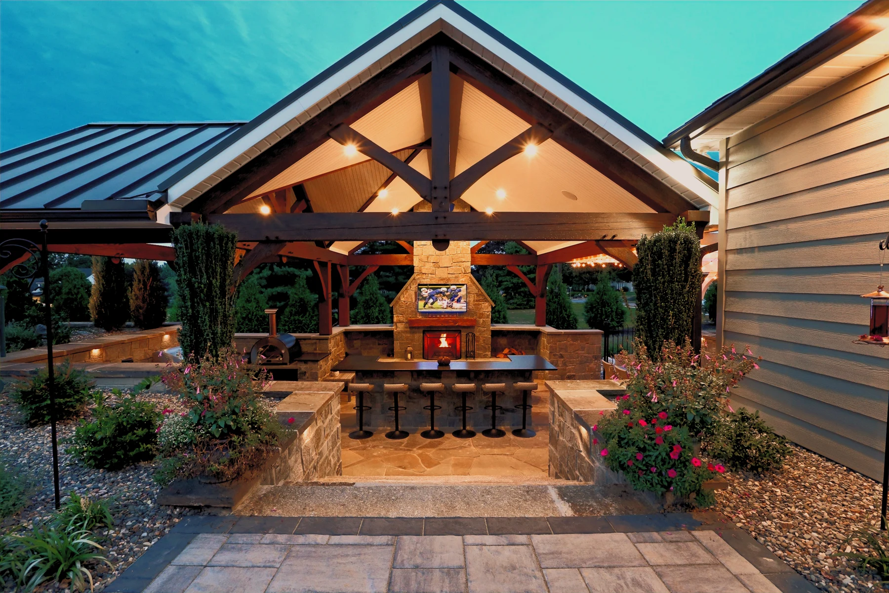 Outdoor living space with an installed television and audio system