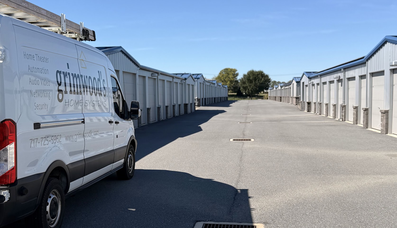 Grimwood’s Home Systems van between storage buildings at Airport View Self Storage in Lititz, PA.