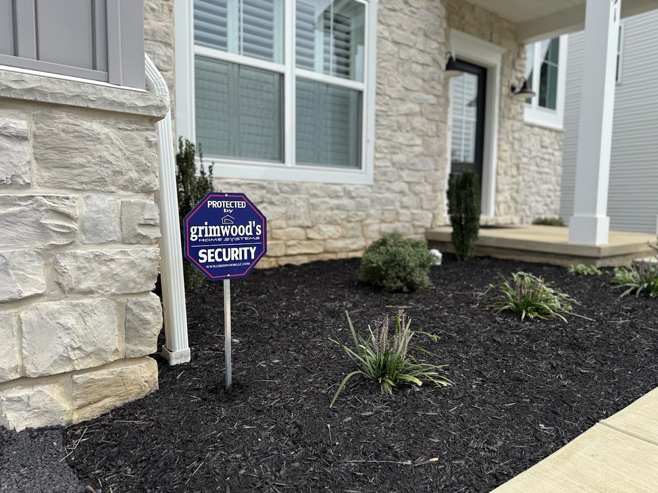 Grimwood’s security sign outside a finished home